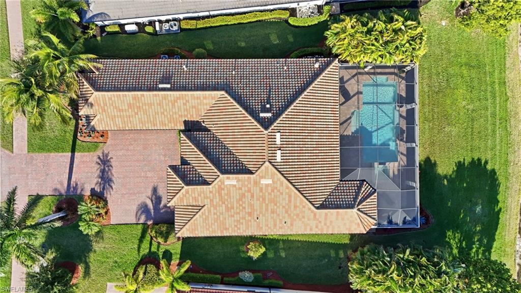 9923 Corso Bello Drive Naples, FL 34113 - Photo 33 of 47 an aerial view of a house with a yard and plants