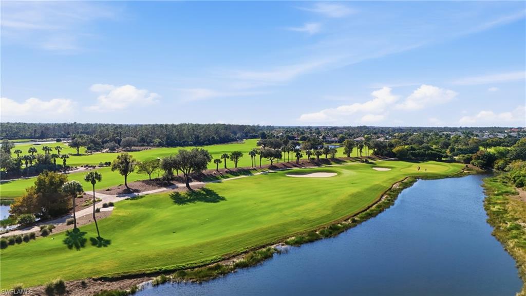 9923 Corso Bello Drive Naples, FL 34113 - Photo 44 of 47 an aerial view of a golf course with a lake view