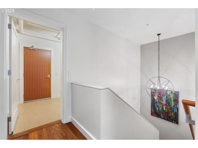 a spacious bedroom with a bed a dresser and book shelf