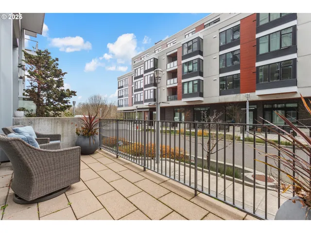 a view of a brick building from a balcony