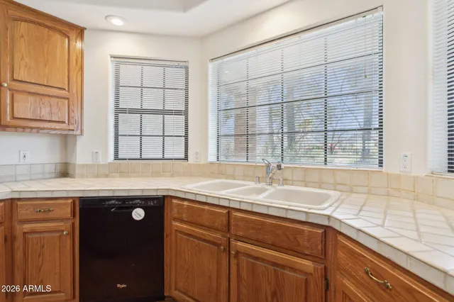 a kitchen with a sink and a window