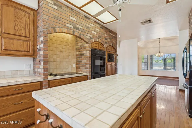 a bedroom with a bed closet and a window