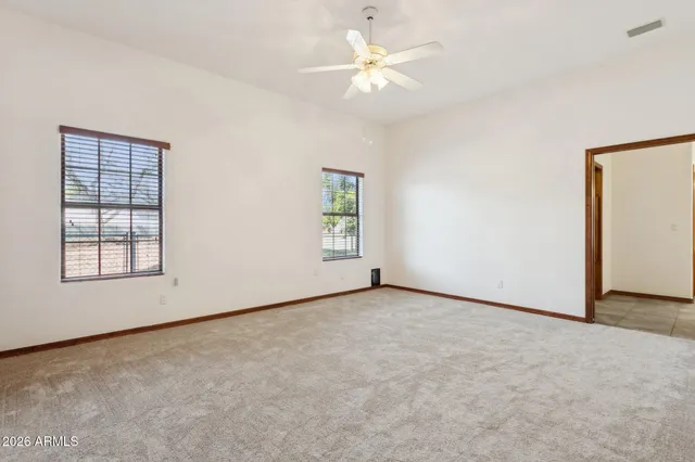 an empty room with fan