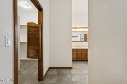 a view of a room with a ceiling fan