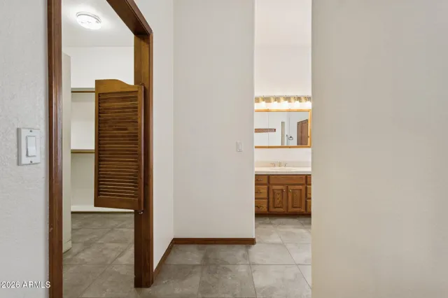 a view of a room with a ceiling fan