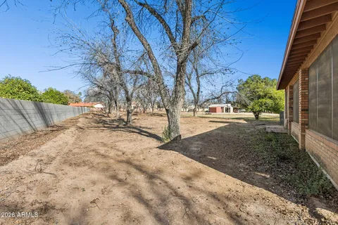 a aerial view of a house with a yard and parking space