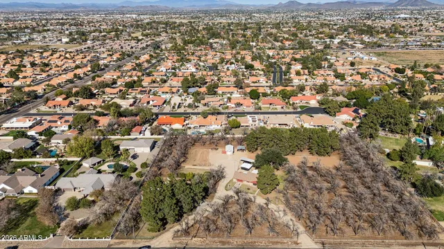 a view of hallway with a large window and chandelier