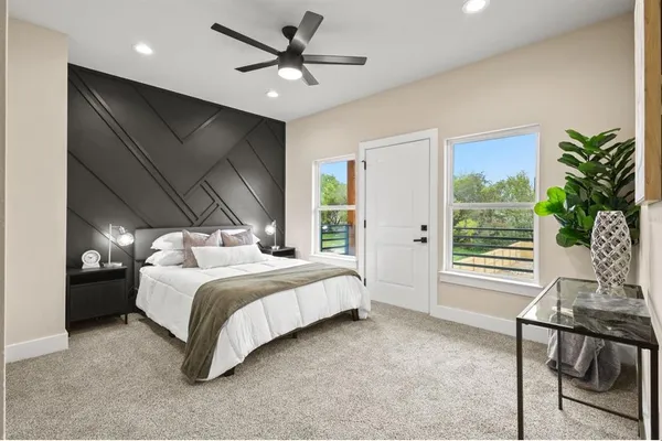 a bedroom with a bed and a table