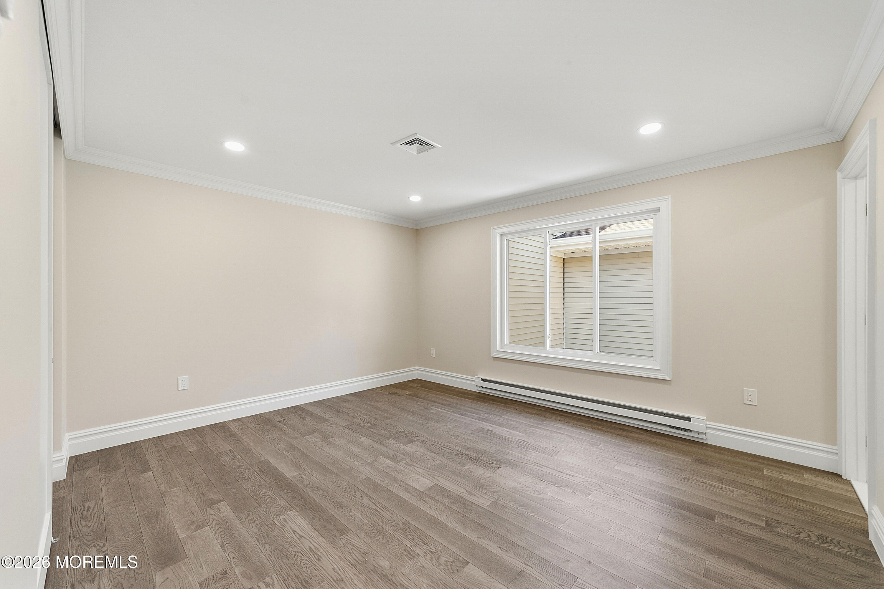 780 B Ardmore Road, Unit 780B Monroe Township, NJ 08831 - Photo 15 of 30 a view of empty room with wooden floor and fan