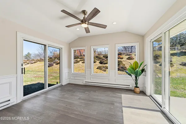 a view of livingroom with furniture wooden floor and front door