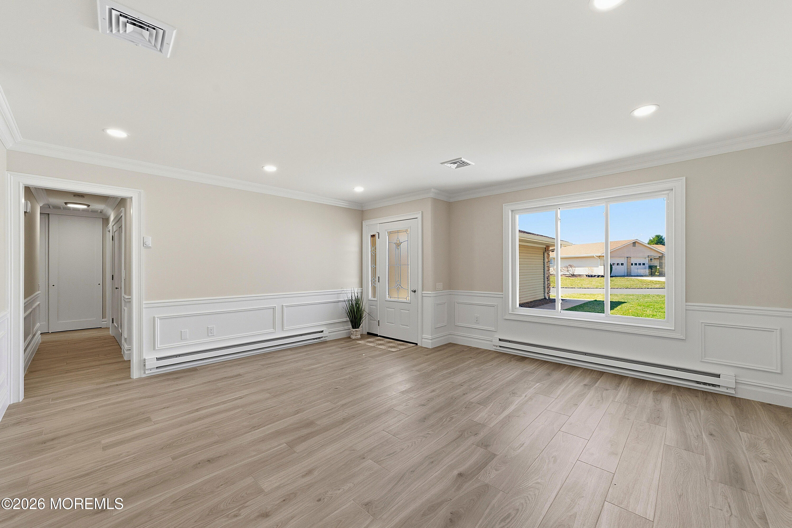 780 B Ardmore Road, Unit 780B Monroe Township, NJ 08831 - Photo 4 of 30 an empty room with wooden floor and window