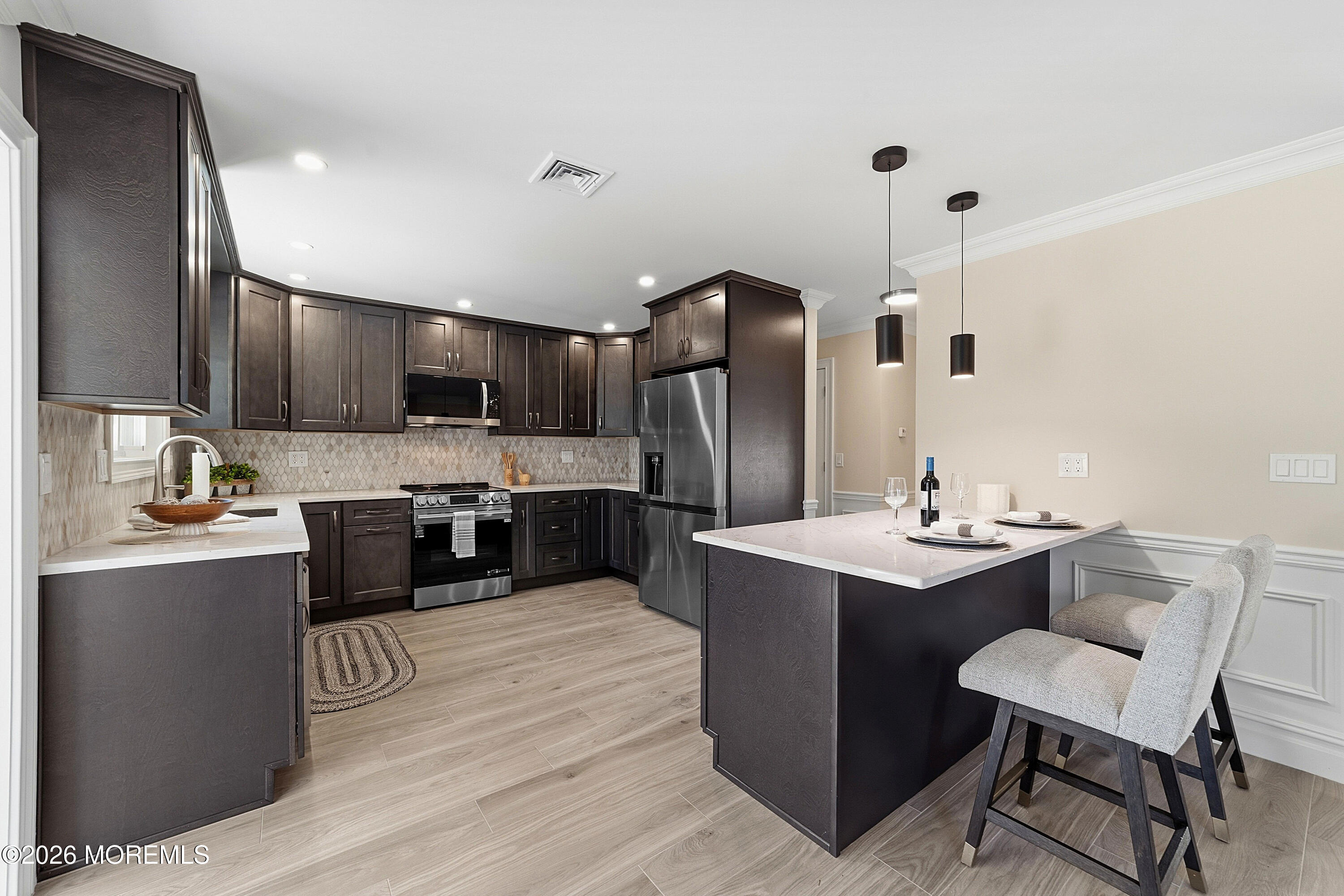 780 B Ardmore Road, Unit 780B Monroe Township, NJ 08831 - Photo 7 of 30 a kitchen with kitchen island stainless steel appliances a sink stove and refrigerator