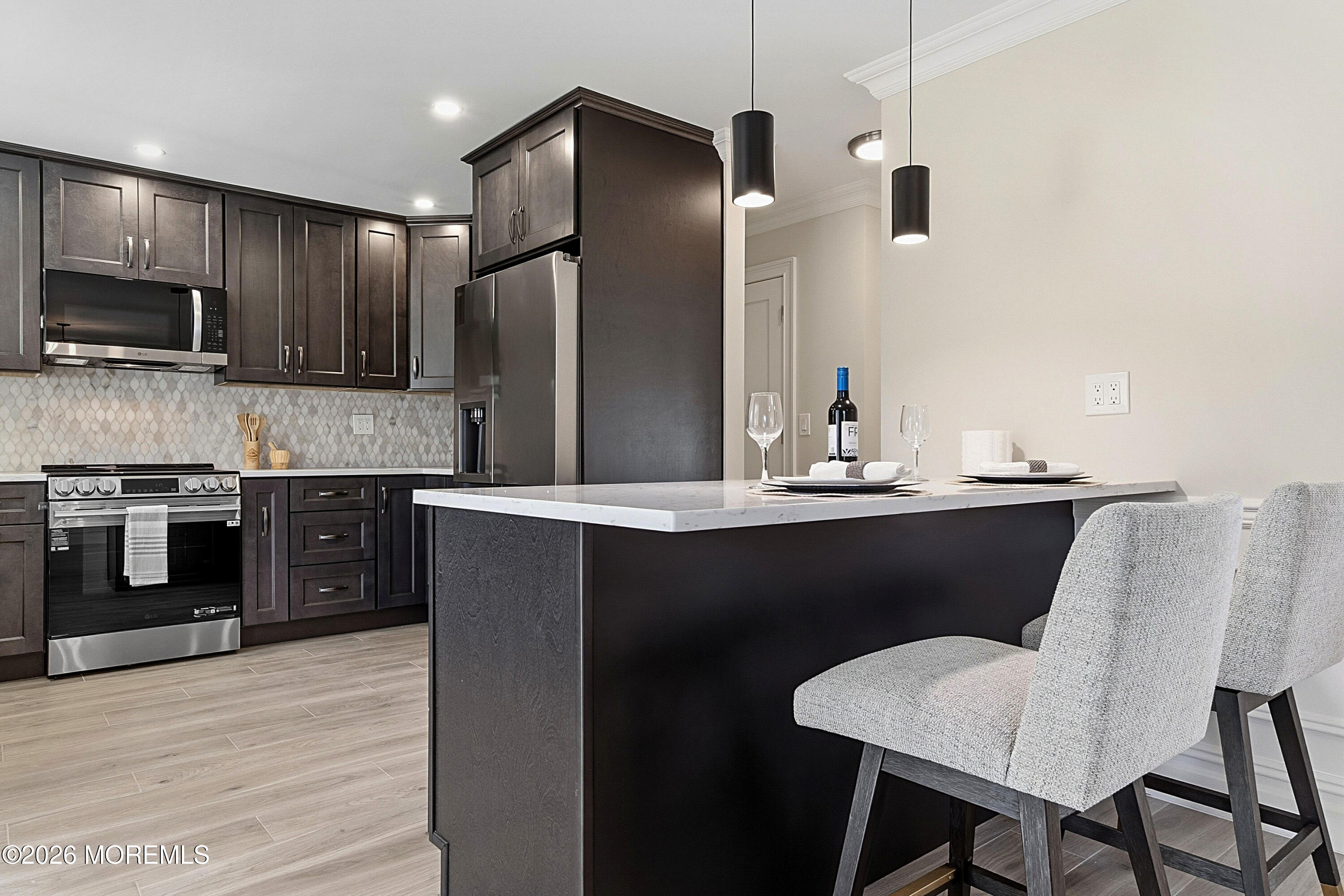 780 B Ardmore Road, Unit 780B Monroe Township, NJ 08831 - Photo 8 of 30 a kitchen with kitchen island stainless steel appliances a stove microwave and cabinets