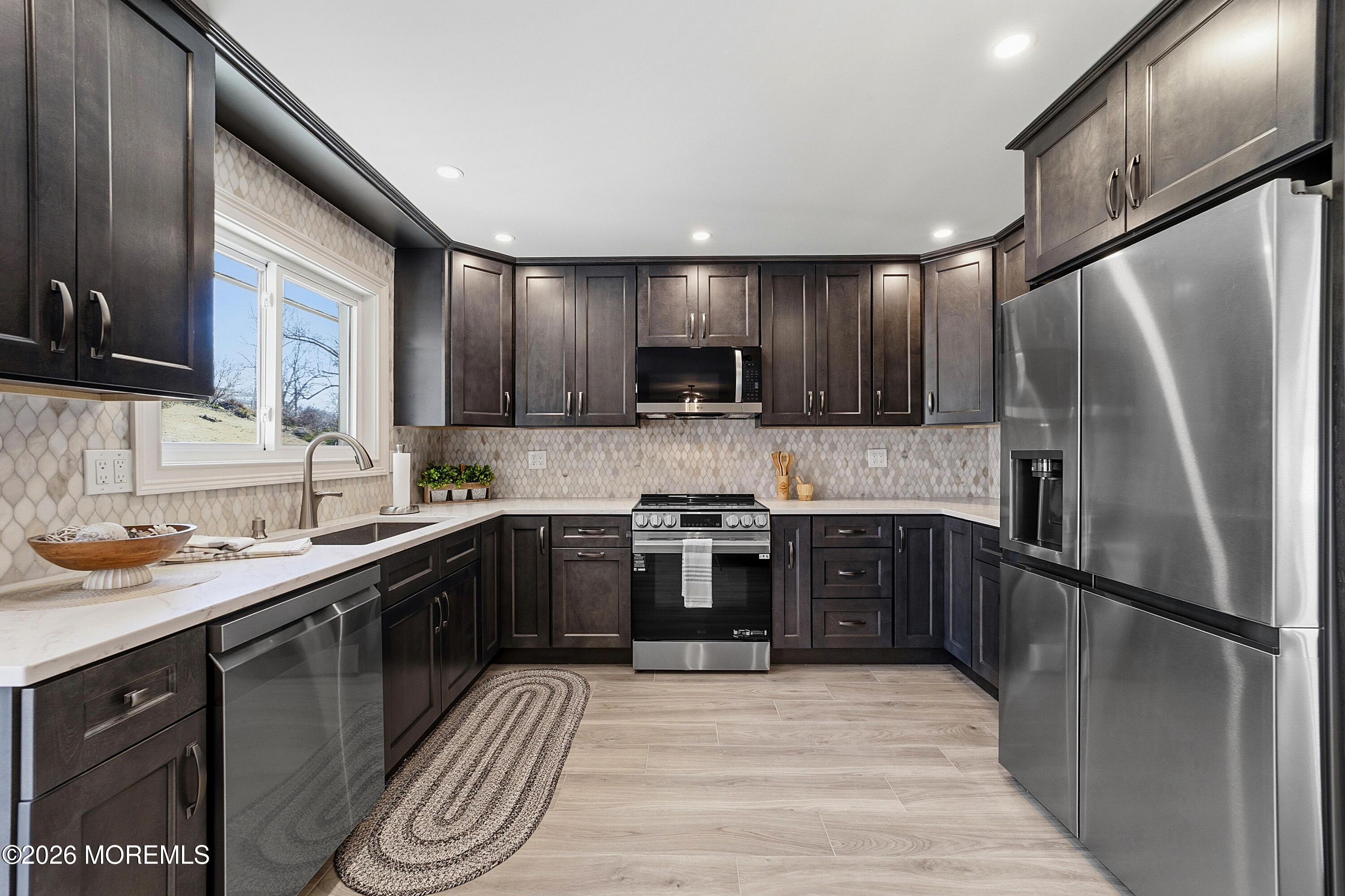 780 B Ardmore Road, Unit 780B Monroe Township, NJ 08831 - Photo 9 of 30 a kitchen with stainless steel appliances granite countertop a sink stove and refrigerator