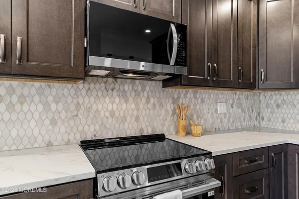 a kitchen with a stove and a microwave