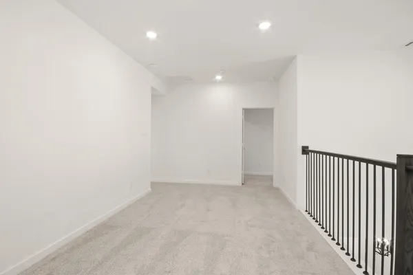 a dining room with furniture and a potted plant