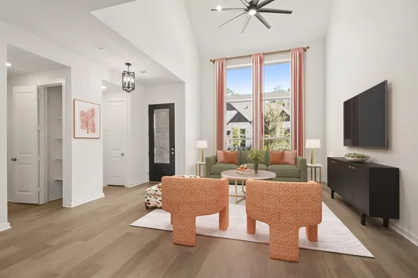 a kitchen with white cabinets appliances and a window