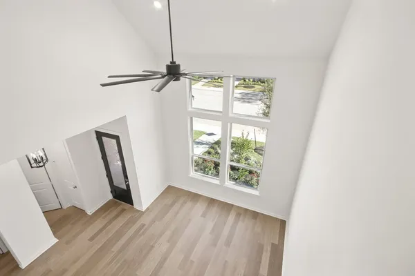 a view of a kitchen with a sink and wooden floor