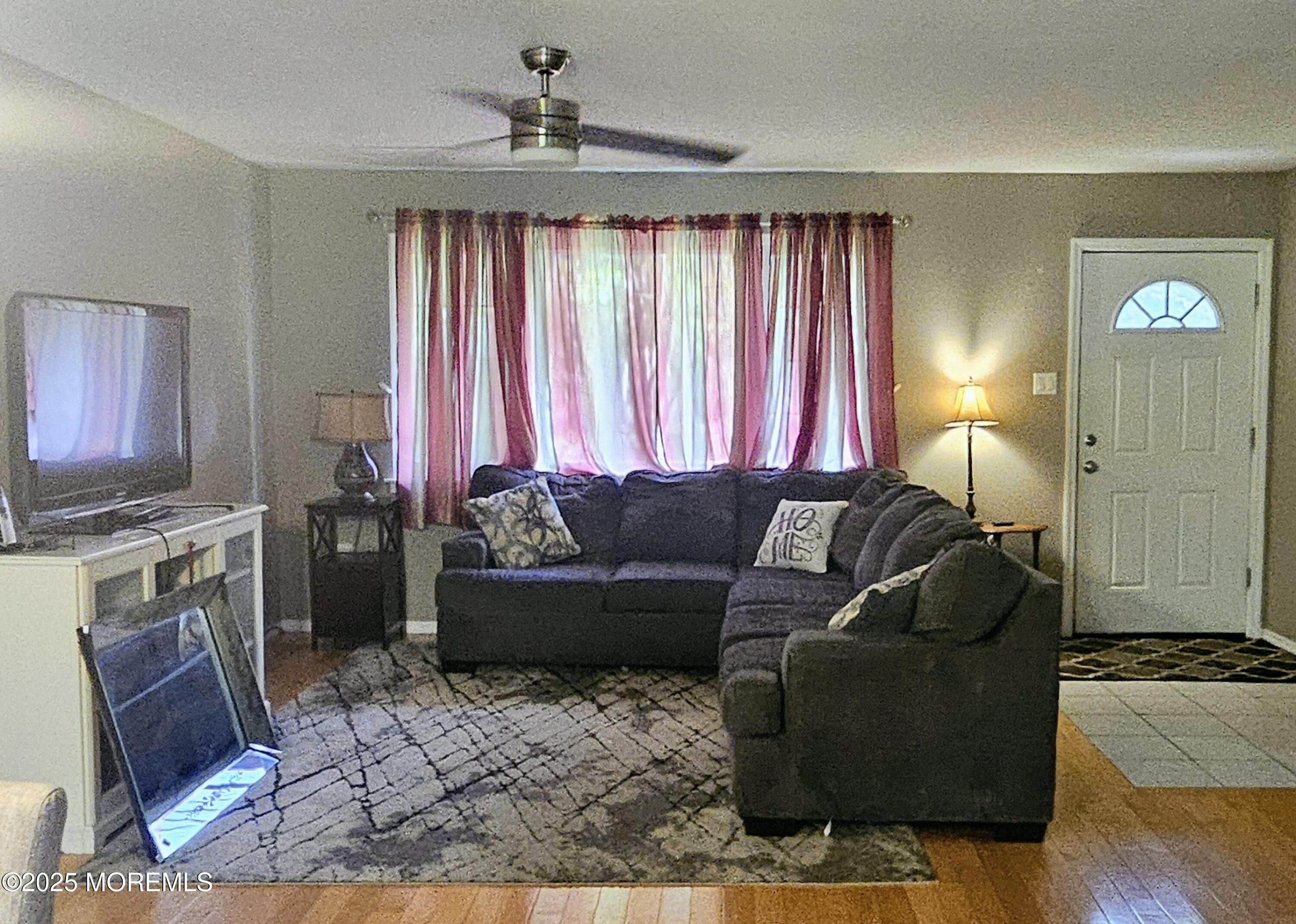 148 Oak Pines Boulevard Pemberton, NJ 08068 - Photo 9 of 38 a living room with furniture and a fireplace