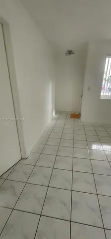 a view of a livingroom and window