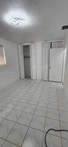 a view of a livingroom with kitchen