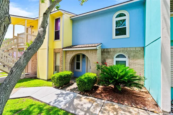 a view of front door of house with yard