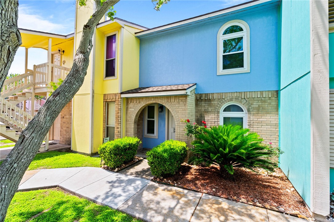 6702 Everhart Road, Unit G105 Corpus Christi, TX 78413 - Photo 1 of 17 a view of front door of house with yard
