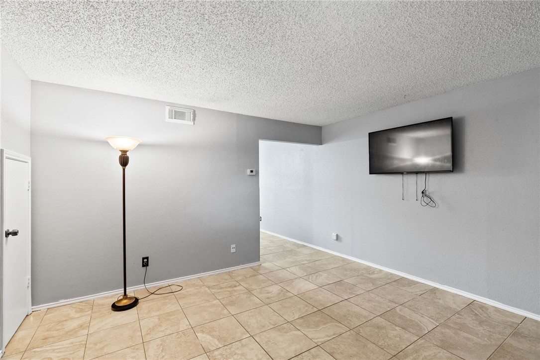 6702 Everhart Road, Unit G105 Corpus Christi, TX 78413 - Photo 4 of 17 a view of a livingroom with wooden floor