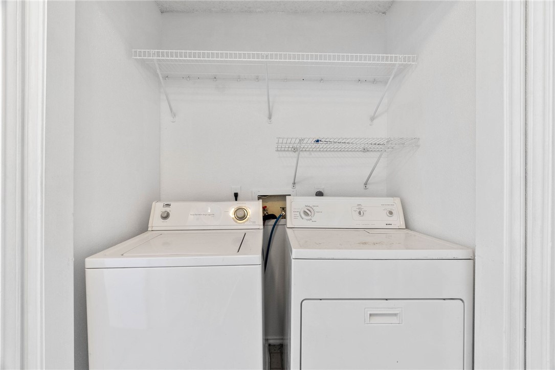 6702 Everhart Road, Unit G105 Corpus Christi, TX 78413 - Photo 10 of 17 a utility room with dryer and washer
