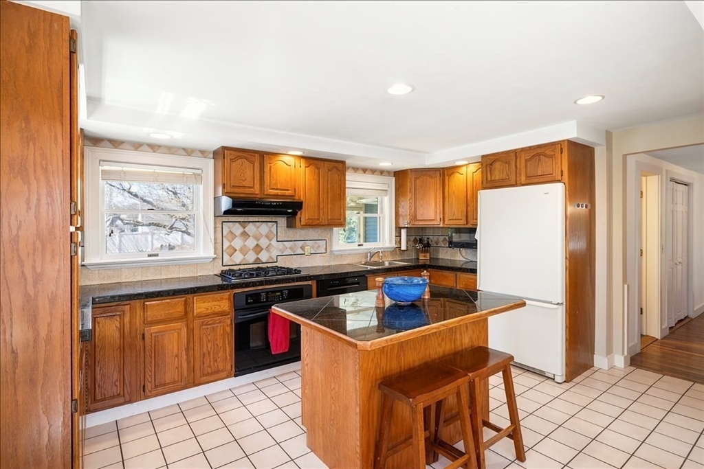 10 2nd Street Natick, MA 01760 - Photo 5 of 31 a kitchen with stainless steel appliances granite countertop a refrigerator and a stove top oven