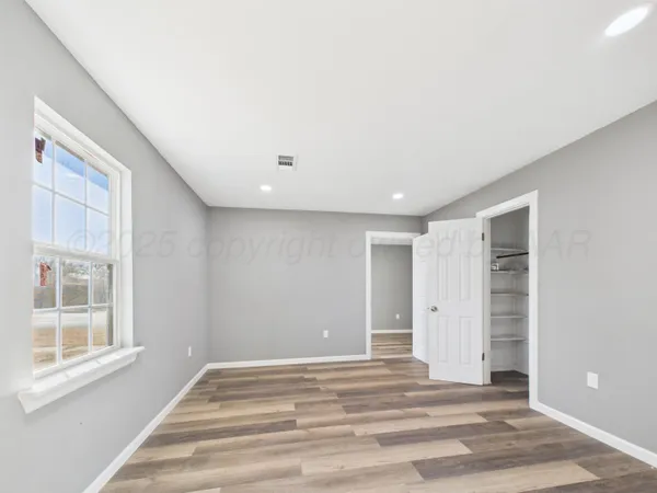 a view of a livingroom with a fireplace and window