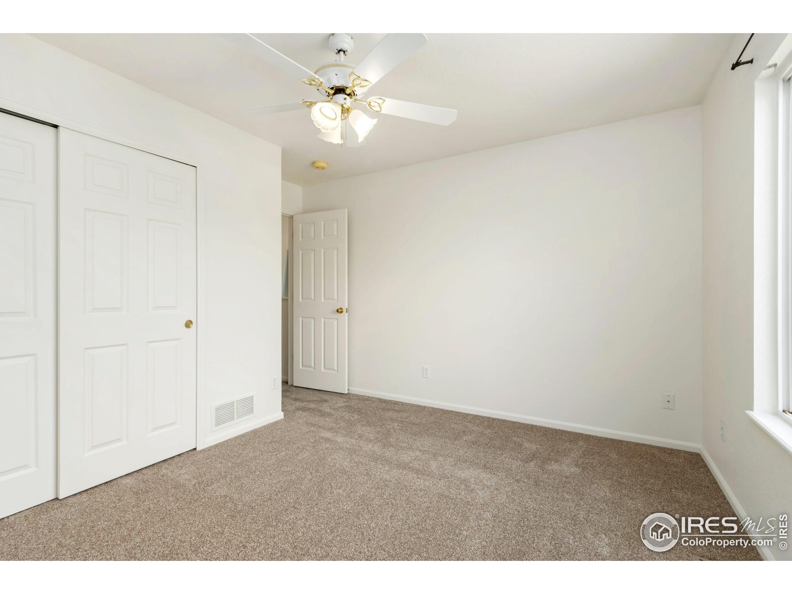 2925 West Stuart Street, Unit 11 Fort Collins, CO 80526 - Photo 18 of 34 a view of an empty room