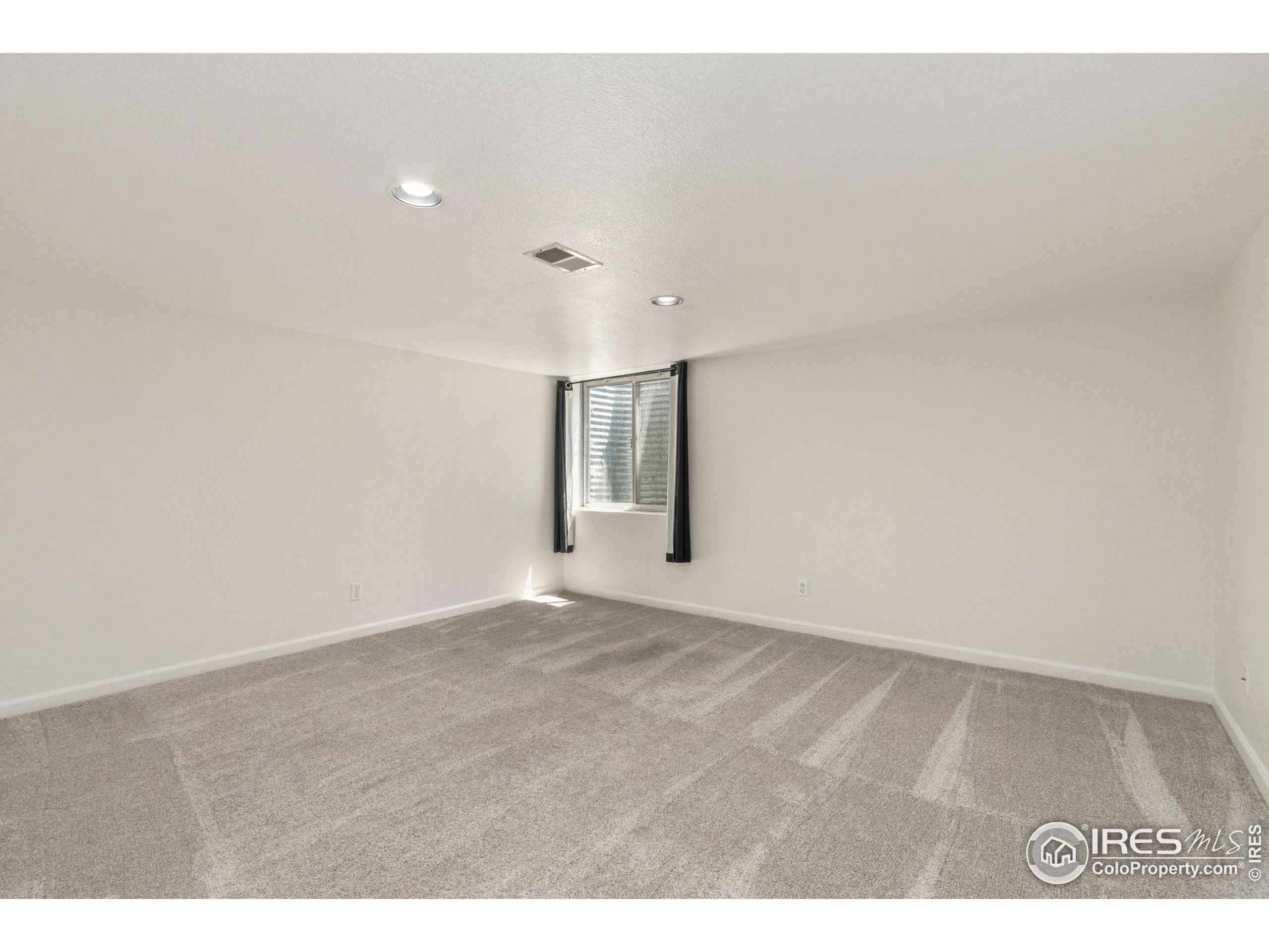 2925 West Stuart Street, Unit 11 Fort Collins, CO 80526 - Photo 27 of 34 a view of an empty room