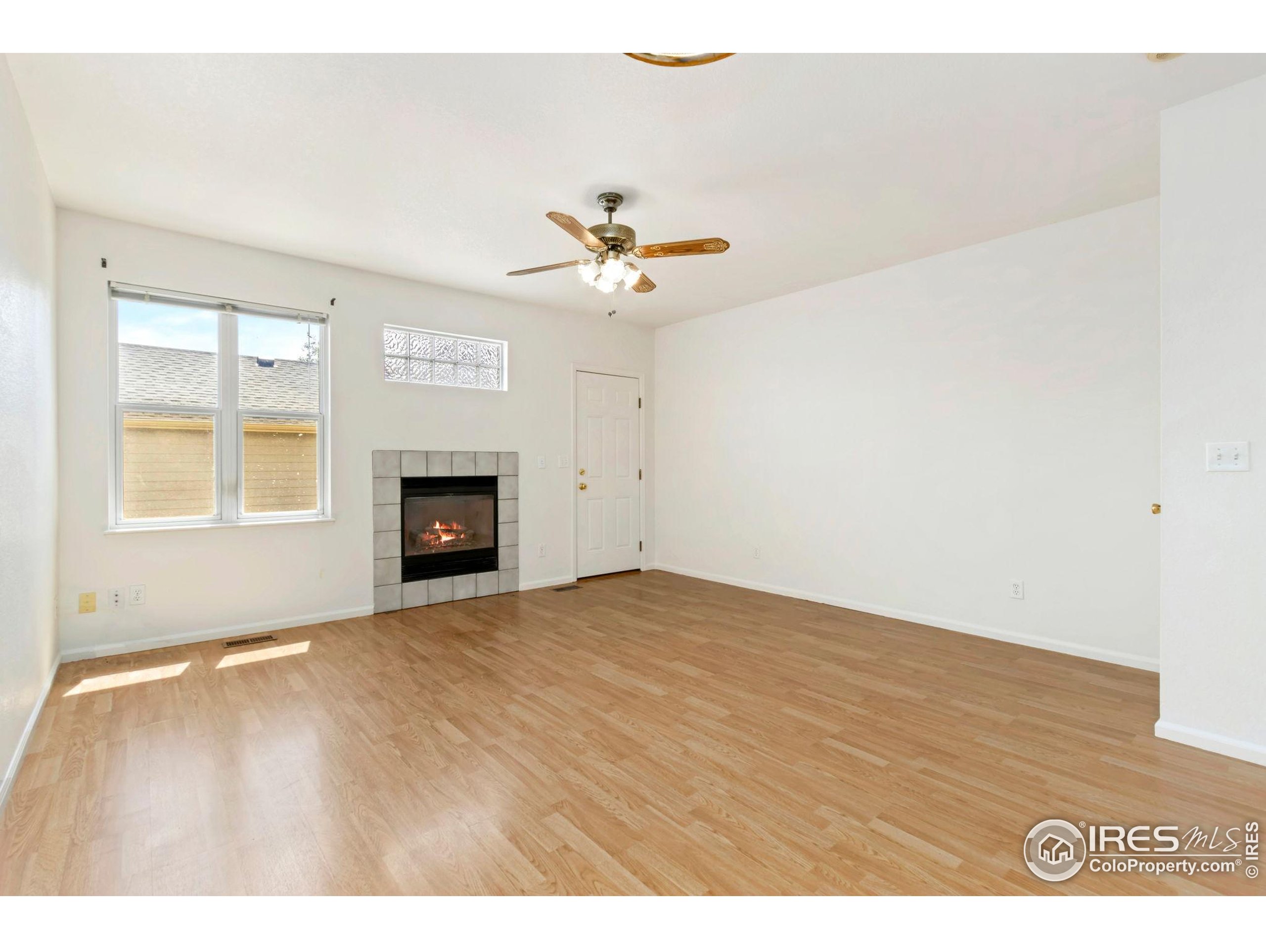 2925 West Stuart Street, Unit 11 Fort Collins, CO 80526 - Photo 10 of 34 a view of an empty room with a fireplace