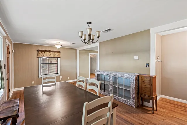 a view of a livingroom with furniture and wooden floor