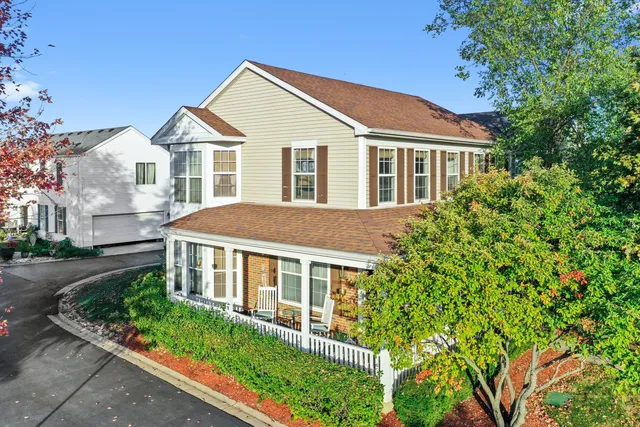a view of a house with a yard and garage