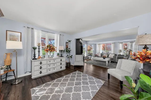a dining room with wooden floor and breakfast area