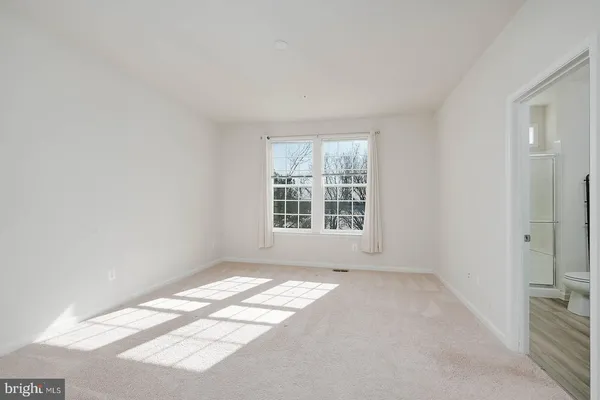 a view of a room that has a window in it