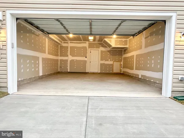 a view of a room with wooden walls