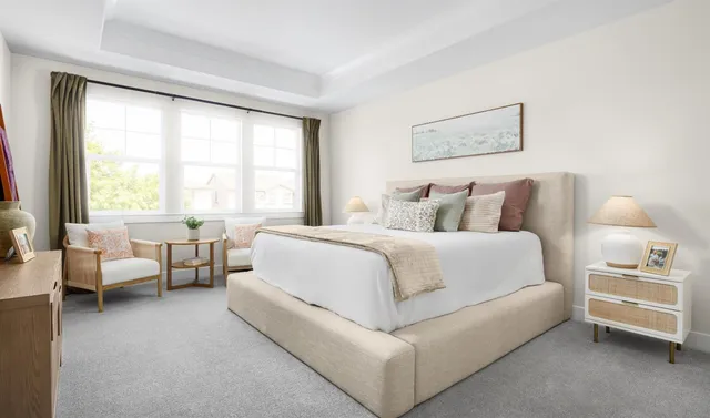 a bedroom with a bed and a couch