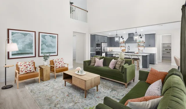 a living room with furniture and painting on the wall