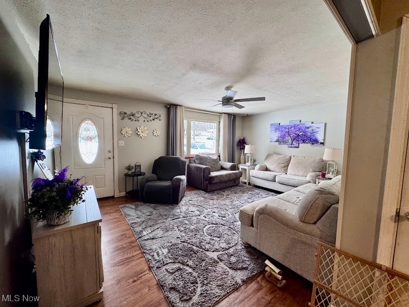240 Spring Creek Road Northfield, OH 44067 - Photo 11 of 39 Living room featuring hardwood / wood-style flooring, ceiling fan, a textured ceiling, and a wealth of natural light