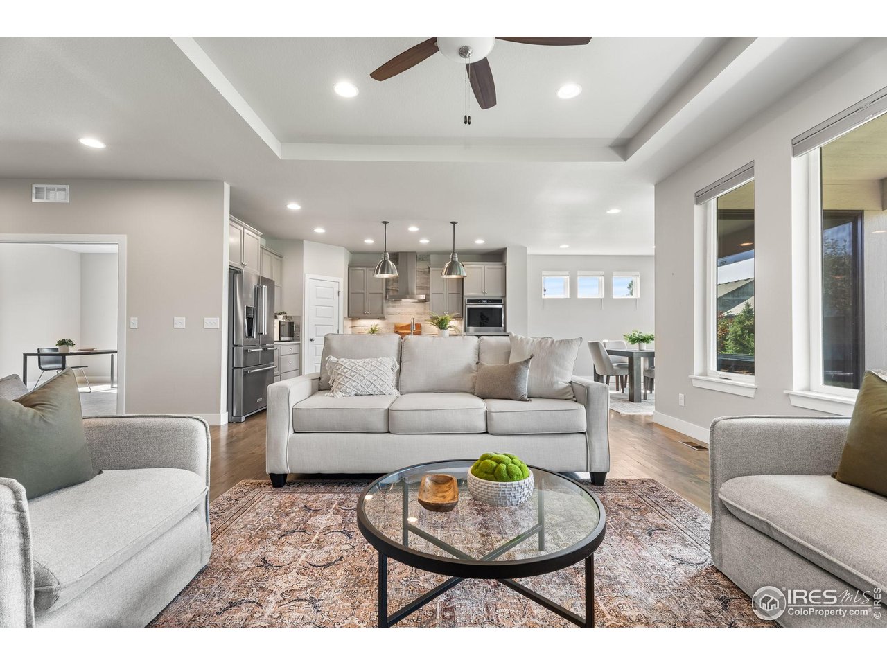 6977 Foxton Court Timnath, CO 80547 - Photo 11 of 32 a living room with furniture and a large window