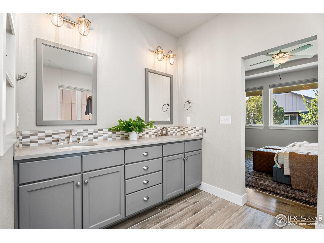 6977 Foxton Court Timnath, CO 80547 - Photo 23 of 32 a bathroom with a sink and a mirror