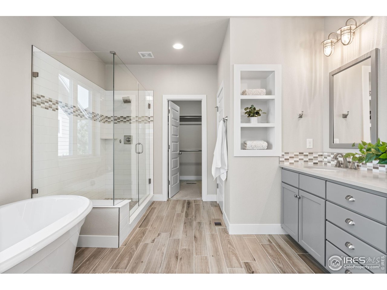 6977 Foxton Court Timnath, CO 80547 - Photo 24 of 32 a bathroom with a sink a toilet a tub and shower
