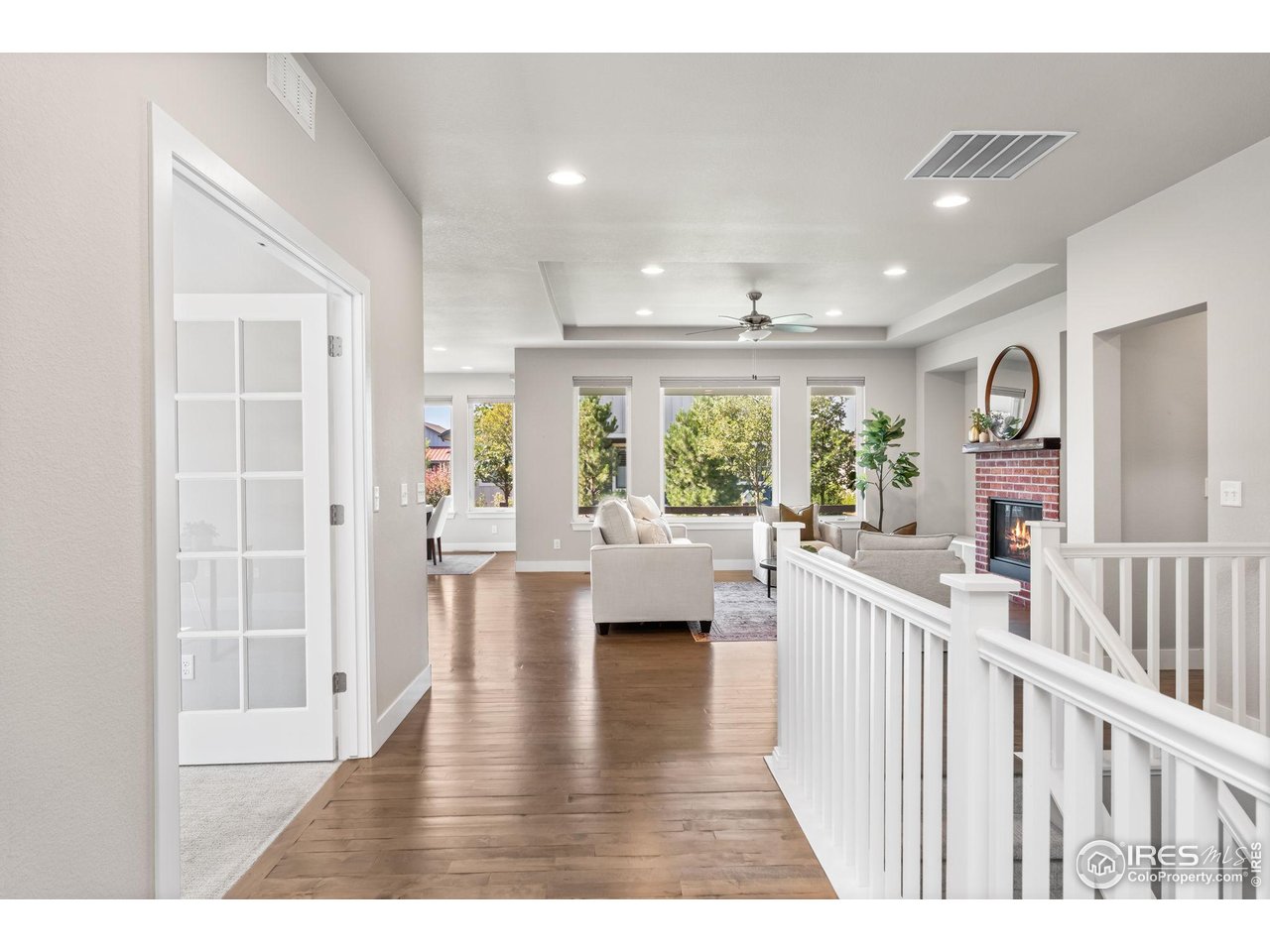 6977 Foxton Court Timnath, CO 80547 - Photo 4 of 32 a view of an entryway with wooden floor