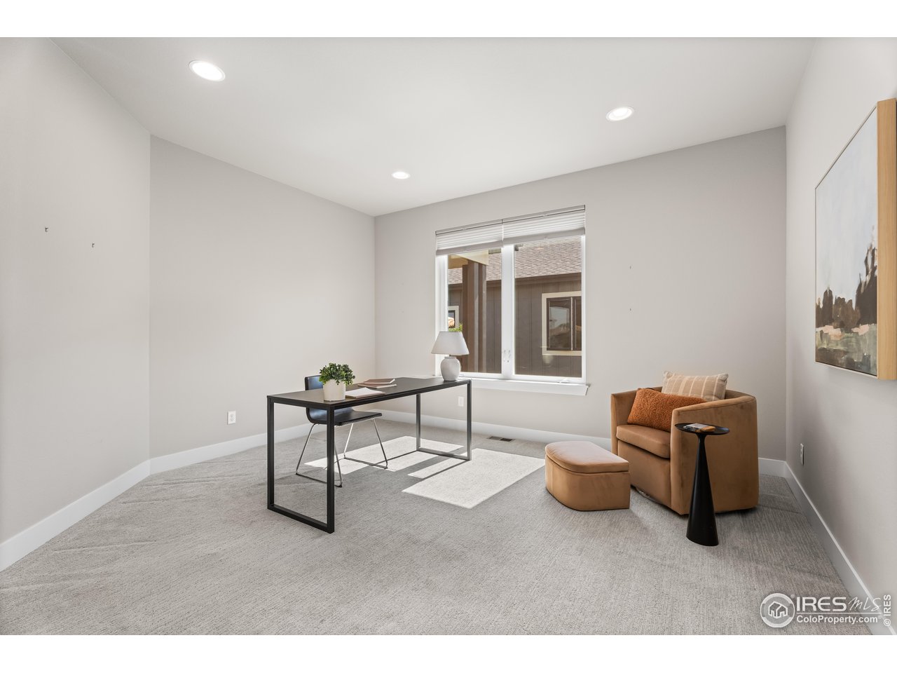 6977 Foxton Court Timnath, CO 80547 - Photo 5 of 32 a living room with furniture a window and a potted plant