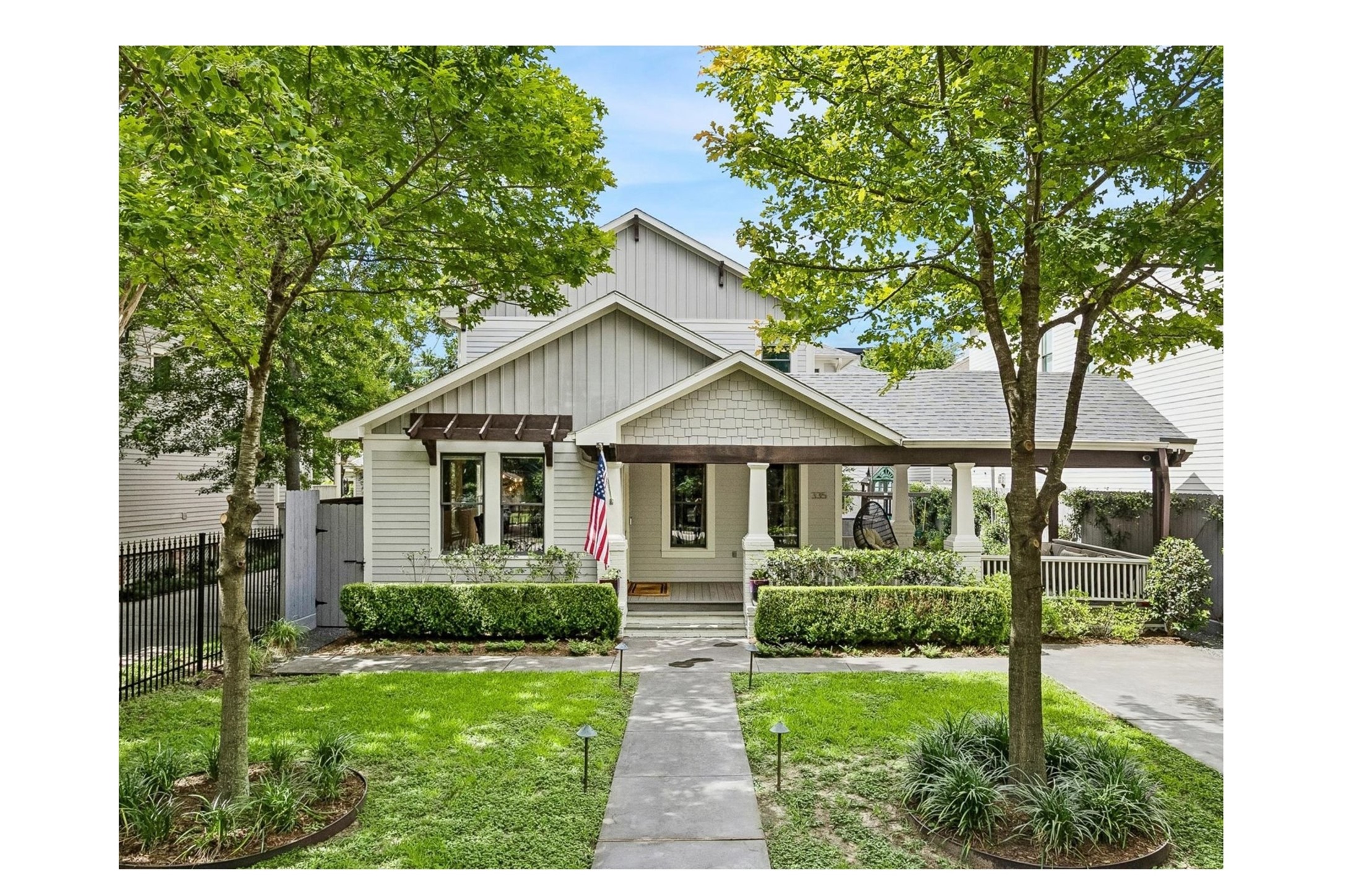 335 West 23rd Street Houston, TX 77008 - Photo 1 of 40 a front view of a house with a yard and potted plants