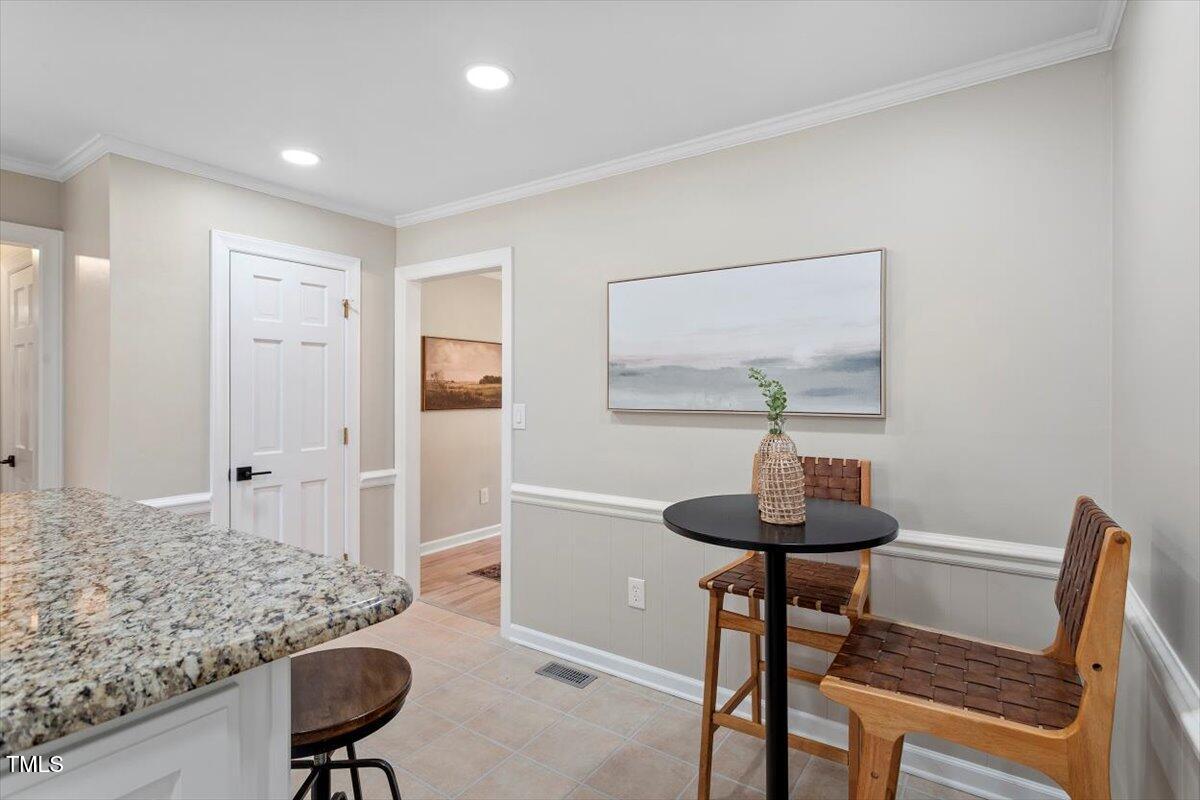 7300 Grist Mill Road Raleigh, NC 27615 - Photo 12 of 41 a view of a livingroom with furniture and wooden floor