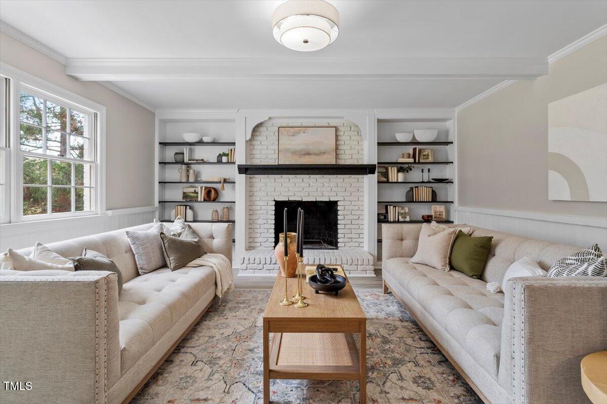 7300 Grist Mill Road Raleigh, NC 27615 - Photo 13 of 41 a living room with furniture and a fireplace